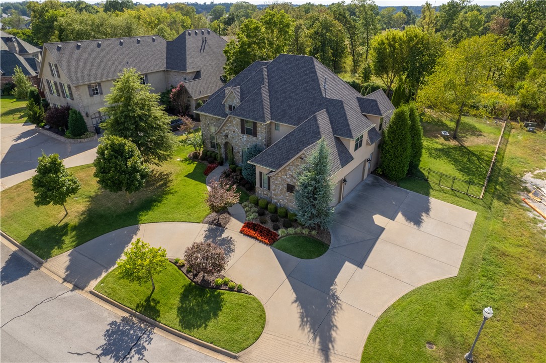 This jaw dropping custom built home located in Pinnacle Country Club has all the amenities of an at home oasis!  The private back yard is made for entertaining featuring a gas firepit, outdoor kitchen, saltwater pool with rock waterfall. This 4 BR, 3.5 BA home has upgraded appliances, walnut wood flooring, central vac, Irrigation, commercial grade hot water tank w/recirculating hot water, and more. Enter the home and be blown away with the stunning entry. Located off the entry is the home office to the left and the formal dining room to the right. Continue into the kitchen featuring double ovens, gas 6 range cook top, center island with counter seating, and granite counter tops. The eat in kitchen features a butler’s pantry with wine fridge, bar sink, and ice maker. Relax in the spacious primary suite with access to the patio, dual vanities in the primary bath, generous closet & access to laundry. 2nd story features built ins, theater room w/ kitchenette and 1/2bath, 3 guest BR’s & 2 full bathrooms.