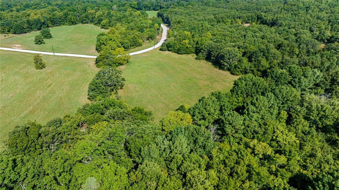 Located in Goshen Arkansas and in the Fayetteville School District you will find a rare opportunity to build your custom home on a private five acre lot (with water tap already in place) located in the prestigious Cedar Ranch Estates. Designed to preserve the natural beauty and privacy appreciated in the Goshen area, and with opportunity to design the perfect dream estate. Each lot is uniquely different ranging from beautiful valley views, to stream side oasis, to pond side elegance, to rolling grassy fields. With each lot you will have the opportunity to create a home on an estate sized lot with the unique features desired by everyone. Come visit Cedar Ranch Estates and make it your last home.