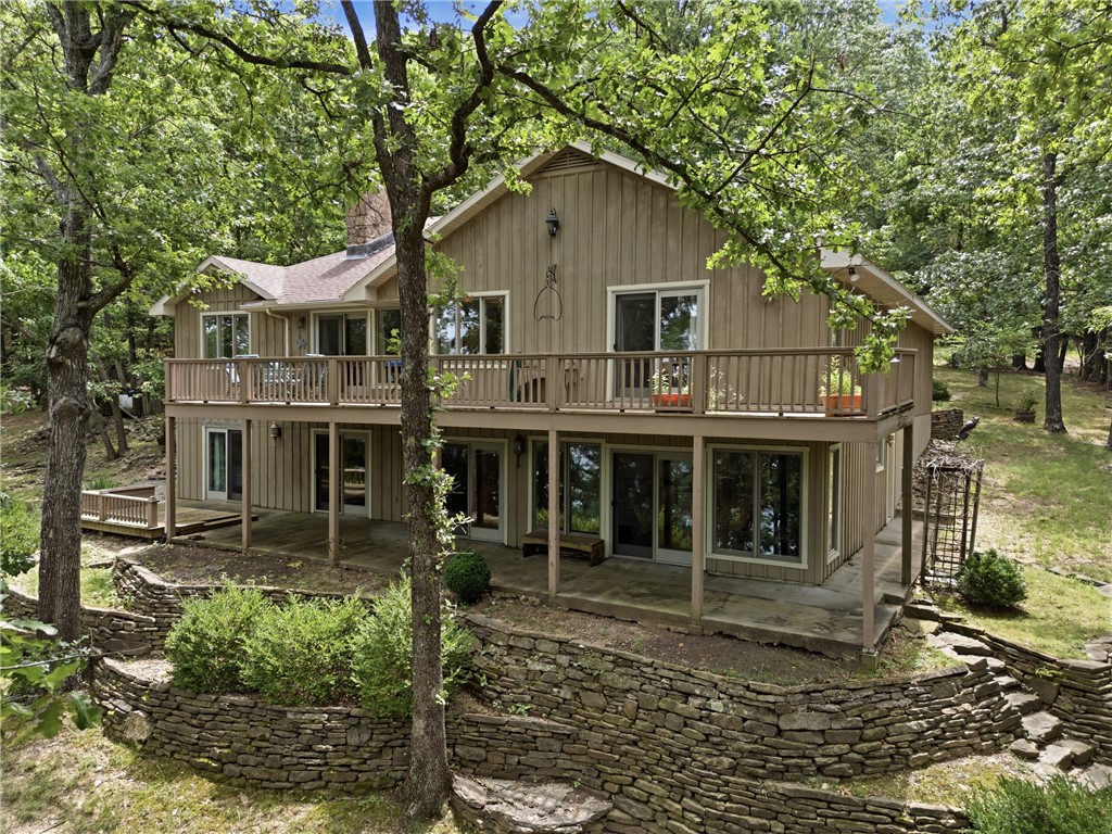 Discover an exceptional single-family residence in the quiet and private Sunset Shores Subdivision  891 Lakeview DR, Eureka Springs, Arkansas, built in 1998. This property, spanning 3257 square feet and Lake front lot of 2.15ac, This property offers a unique opportunity for sophisticated living in a desirable location just a stone throw across the cove from Starkey Marina. With four dedicated bedrooms, this home provides ample personal space and flexibility for various living arrangements, ensuring comfort and privacy for all. This property presents a compelling opportunity to embrace a vibrant lifestyle on Beaver Lake.