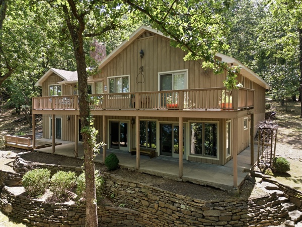 Discover an exceptional single-family residence in the quiet and private Sunset Shores Subdivision  891 Lakeview DR, Eureka Springs, Arkansas, built in 1998. This property, spanning 3257 square feet and Lake front lot of 2.15ac, This property offers a unique opportunity for sophisticated living in a desirable location just a stone throw across the cove from Starkey Marina. Easily just hop on Beaver Lake with your new to you 2022 27' Bennington Model 25 Bowrider 300 hp Yamaha Tritoon. With four dedicated bedrooms, plus bonus rooms this home provides ample personal space and flexibility for various living arrangements, ensuring comfort and privacy for all. This property presents a compelling opportunity to embrace a vibrant lifestyle on Beaver Lake.