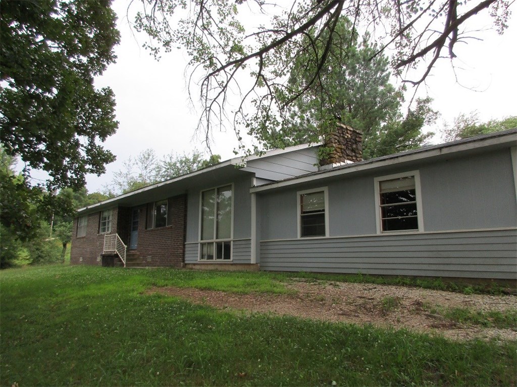Good home, close to town. Wood burning fireplace, 3 bedrooms, 2 bathrooms, on large lot.