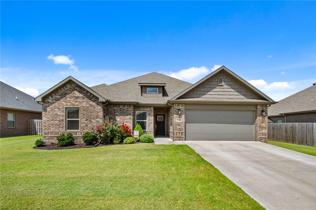 The oversized covered patio is the highlight of this home, creating the perfect outdoor living and entertaining space! Enjoy watching the game, grilling or relaxing while overlooking the fully fenced backyard. Inside, you'll find a thoughtfully upgraded 4-bedroom, 2-bath home with a desirable split floor plan, open layout, high ceilings and expansive windows that fill the living room with natural light while showcasing the backyard. Cozy up by the gas fireplace or gather in the kitchen featuring a large island, gas range and pantry. The master suite showcases a designer accent wall, double vanities, jetted tub, walk-in shower, private water closet and two closets. The spacious laundry room with extra storage is conveniently located just outside the master suite. The neighborhood has a playground, basketball court and pavilion. Minutes from Pea Ridge schools, Bentonville, the Walmart Home Office, Crystal Bridges, shopping, dining and located within Walmart's drone delivery area for added convenience.
