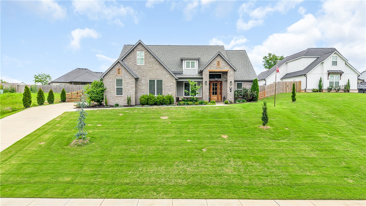Oh my gosh, you have to see this house! Built in 2020, this 4 bedroom, 2.5 bath home in Pea Ridge's Sugar Creek neighborhood sits on a third of an acre and has the most beautiful open floorplan flooded with natural light. The grand entrance and big covered porch totally wow you the moment you pull up. Inside, you've got hardwood floors, a gas fireplace, granite countertops, stainless appliances, and a walk-in pantry — it's basically everything on your wish list. The primary suite feels like a spa retreat with a gorgeous bath and huge walk-in closet. And get this — it's a smart home with Nest cameras, keyless entry, and Bose surround sound all running through Google Home. They even extended the back patio and added a pergola in 2025, so the outdoor space is incredible. It's close to the golf course, great walking and cycling roads, and shopping. — seriously, you need to come see it!