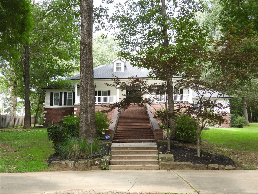 Luxury, Integrity, Nestled on a prime lot, this exceptional custom-built estate with sophisticated design. Built with 2x6 exterior walls and high-efficiency double-pane windows, this home offers superior energy efficiency and quiet comfort. Step inside to a striking, sun-drenched open-concept living area framed by soaring, tall windows that offer picturesque views of your private backyard oasis. Elegant custom millwork, crown molding, and a seamless blend of rich hardwood and durable tile flooring flow throughout the main level. The gourmet chef's kitchen is a true showstopper, boasting: An extra-large central island perfect for gathering. Premium granite countertops. High-end, professional-grade appliances, including a double refrigerator setup. A sleek, custom professional vent hood. Primary suite, a private sanctuary featuring dual vanities. Unfinished basement excellent storage. Oversized 3-car garage w/LED light. Seller is providing a 1-year comprehensive home warranty at closing for ultimate peace of mind.