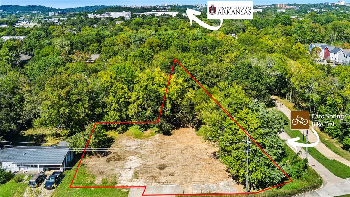 Positioned for possibility, this 0.49-acre property offers exceptional development and commercial potential with flexible Neighborhood Services-General zoning. Permitted uses include cluster homes, commercial businesses, professional services, sidewalk cafes and more.

Located directly along the Greenway Trail, the property benefits from built in pedestrian and cyclist traffic, creating unique potential for boutique retail, café concepts, office space, or thoughtfully designed residential development that integrates seamlessly with outdoor recreation. Utilities are on site, helping streamline the development process. The property is partially located in a designated floodplain; however, there is no known history of flooding. Buyers are encouraged to verify zoning allowances, floodplain requirements, and intended use with city planning.

Conceptual rendering photos available upon request. This is a rare opportunity to secure a strategically located parcel with strong upside potential in a growing area.