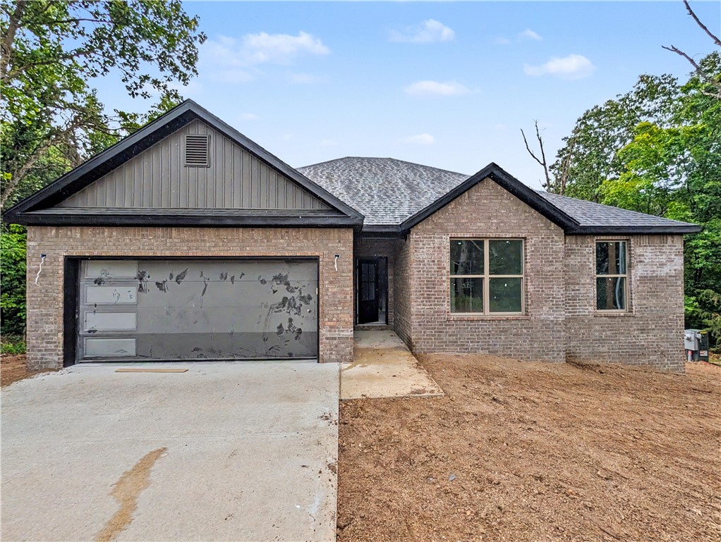 Welcome To Your Next Home At 13 Angus Lane! Located Just Minutes From I-49, Lake Loch Lomond, And Golf, This Home Perfectly Blends Convenience With An Active Lifestyle. The Design Features A Classic Brick Front And A Smart Split Floorplan. 9-Foot Ceilings In All Secondary Areas. Vaulted Living Room With Decorative Beams In The Living. Step Into The Kitchen Featuring Upgraded Ceiling-Height Cabinets, Quartz Counters, And A Large Island. The Primary Suite Offers A Custom Tile Shower And A Walk-In Closet That Conveniently Connects To The Laundry Room. Relax On Your Covered Back Deck Overlooking A Freshly Sodded Yard And Peaceful Views. Don't Miss The Chance To Make This One Your Own!  **Property Is Deeded As A 2-Bedroom Septic; The 3rd Room Is Intended As An Office/Bonus Space Or Other Non-sleeping Room. Signed Acknowledgment Required.