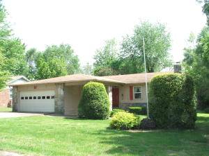 Neat stone & frame 3 BR 2 BA home in pretty neighborhood convenient to Wal-Mart. Home has pretty stone work fireplace, newer thermal pan windows, pantry, folding counter in utility, 19'10 x 10' covered porch, 16' x 10' covered deck, attached 2 car garage & beautiful landscaping. Utility shed. Worth the money! All #'s approximate.