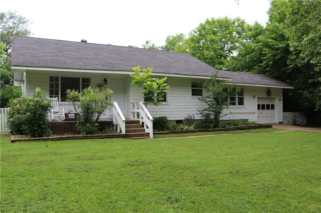 This renovated farmhouse features 2 bedrooms and 2 bathrooms with a bonus room that could be used as a home office or den. It has a large backyard, spacious screened in porch, and an attached 1 car garage. The large windows all around the house bring in an abundance of natural light! The spacious kitchen opens to the dining area and boasts of new stainless steel appliances, classic subway tile backsplash, high cabinets and a pantry. This home features vinyl plank floors throughout and washer/dryer is included. The large backyard has ample outdoor space that backs up to an empty field and has the most beautiful sunset views. The ductless mini split heating and air system offers room-by-room temperature control while saving you money on your energy bill. You get the best of both worlds with a quiet street, yet just one mile from the UofA, and easy access to the freeways. Just a 10 minute walk to the Meadow Valley Trail.