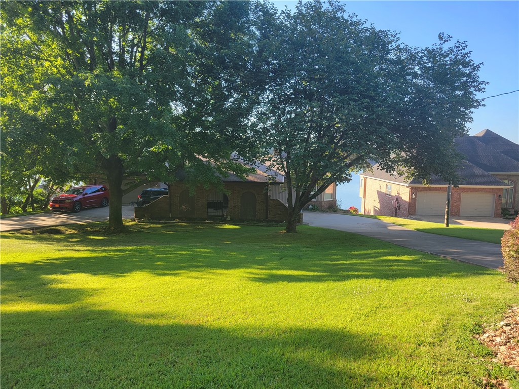 This is a very nicely appointed home in a fabulous location on an extraordinary lot. A rare low-to-the-water property that is an easy walk to your dock and swim deck. Located on wide water with breathtaking views. The interior is a welcoming easy living interior finely tuned for accommodating guests to share the enjoyment. When the water is calm and the sun is just rising there is no more peaceful place to be. The morning room is perfect for starting your day in its eat-in kitchen, The screened-in deck provides shelter and comfort yet affords a great view. There is a Jacuzzi spa room on the lower level and 2 car carport plus a 2 car garage. A must-see! if lake living is in your future.
listing agent is related to the owners.