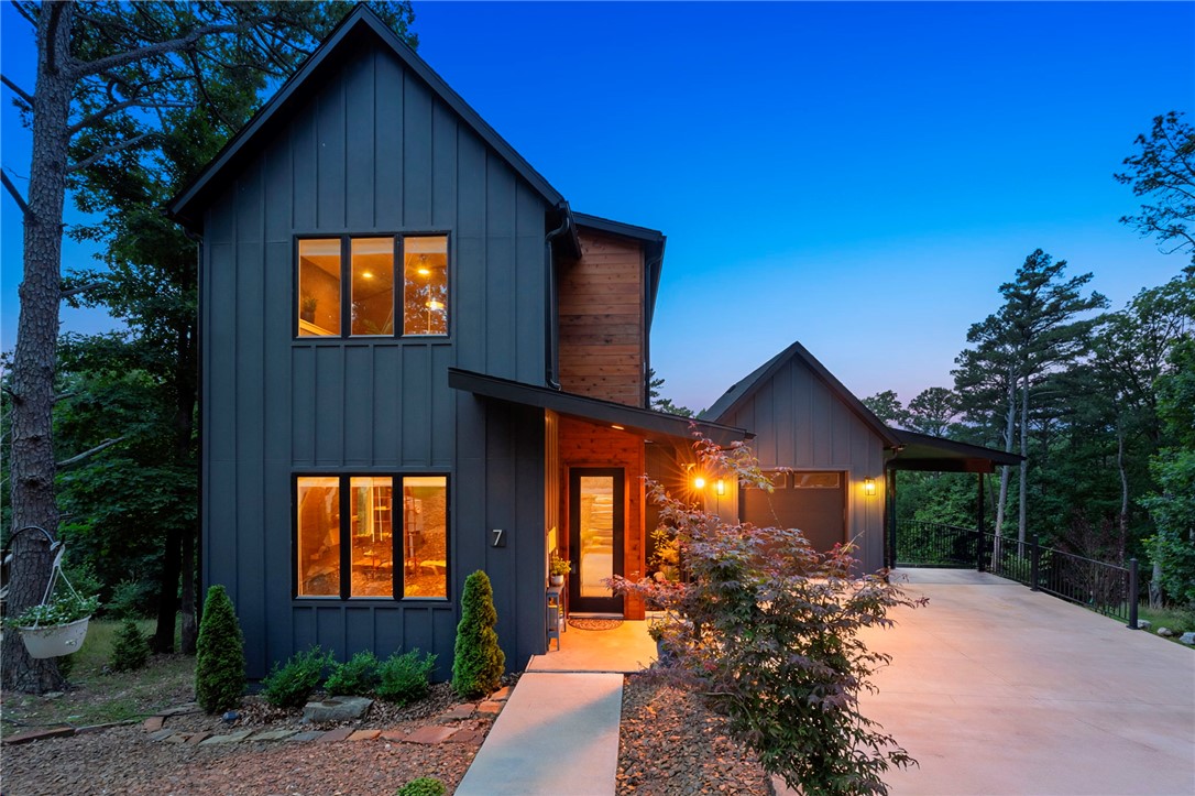 Modern 3BR/2BA home with open-concept living on .42 acres near trails, the lake, and the new Oz bike park lift. Thoughtfully designed with quartz countertops in the kitchen and baths, spacious living areas, a walk-in pantry, and loft office space ideal for remote work or guests. Enjoy two decks plus a peaceful sitting area overlooking green space, lawn, and mature trees. Downstairs bonus area not included in square footage offers flexible space for a workout room, hobby area, or additional storage. Contemporary finishes and functional layout make this home perfect for full-time living or a weekend retreat. Potential future AirBNB opportunity subject to permit availability.