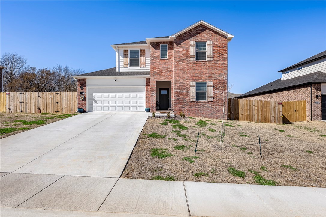 **HOME QUALIFIES FOR LENDER CREDIT UP TO 1% OF PURCHASE PRICE WITH APPROVED LENDER.** Looking for a better than new home near the Razorback Greenway? Don’t miss this spacious 2025 home with upgrades throughout! Features include an electric fireplace, quartz countertops, and a primary suite with dual sinks, oversized tiled shower, and walk-in closet. The main level has 2 bedrooms and a full bath, with 2 more bedrooms, a bonus room, and full bath upstairs. LVP flooring (stairs excluded), ceiling fans, smart switches, and a fenced backyard. Minutes to I-49, trails, schools, and JB Hunt Park.