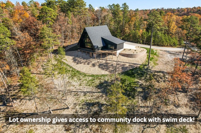 With over 200’ of lake frontage and breathtaking views, this Lakeside A-Frame is a Modern Beauty. Incredibly Efficient and Built to Energy Star Standards including High-Efficiency HVAC, Water Heater, and Bathroom Fans; Fresh Air Make Up System; Encapsulated Foam Walls; Weather Shield Windows and Doors; and Insulated Garage and Garage Doors. No detail was overlooked, so many unique features inside and out make this getaway truly one of a kind. AND lot ownership gives access to community dock with swim deck! Only 20 minutes to downtown Rogers, close to Prairie Creek & the Highway 12 bridge. House plans and Ventris Cove Estates covenants attached in MLS.