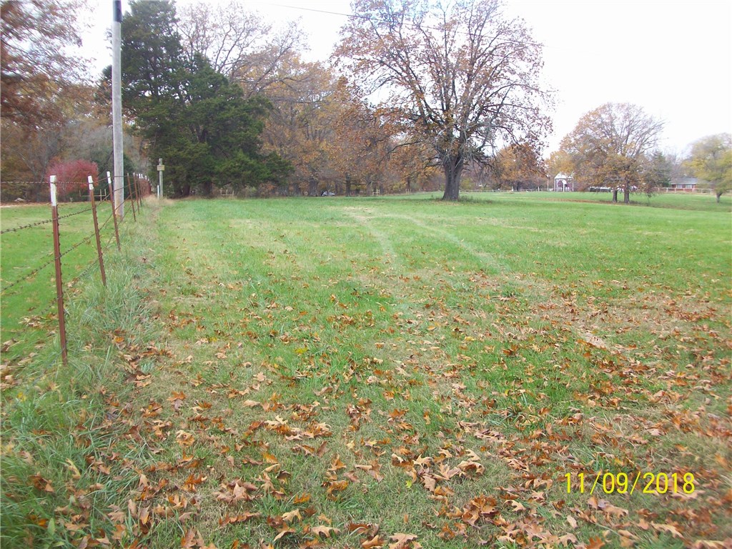 Great location to build your dream home and room for the horses.  Level and has a pond with about 450 foot of road frontage.  Pasture has good grass.  Come and see before it is gone.