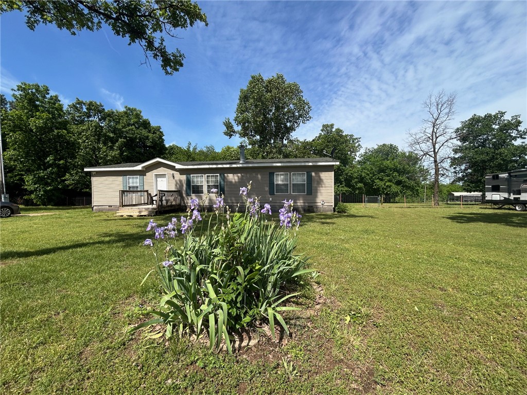 Enjoy the quiet charm of country living in this well-maintained 1,624 sq ft modular home set on just over an acre in a private, serene setting. Tucked away from the hustle and bustle, this property offers the perfect blend of comfort, space, and Privacy.
Inside, you’ll find a desirable split floor plan featuring a spacious master suite complete with a large walk-in closet, relaxing soaking tub, and separate shower. Two additional bedrooms offer plenty of room for family, guests, or a home office.
The eat-in kitchen provides ample cabinet and counter space, making it both functional and inviting for everyday living or entertaining.
Step outside to a fenced backyard with a deck—perfect for enjoying the peaceful surroundings. The property also includes a storm shelter for added peace of mind and a large storage shed for tools, equipment, or hobbies.
If you are looking to be off the beaten path, away from the hustle and bustle of city life, and enjoy the peace and quiet, this is the place for you!