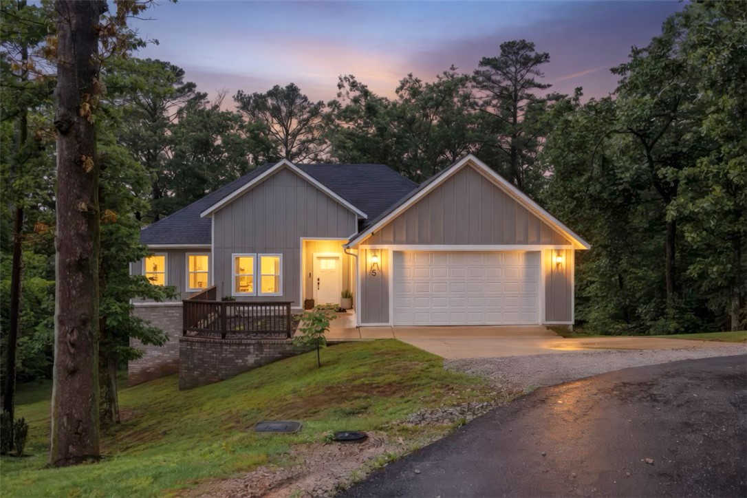 Tucked into the trees with a stunning view on the desirable east side of Bella Vista, this clean, better than new home offers the perfect blend of privacy, convenience, and nature. Situated on sewer, the property allows for a gorgeous wooded backdrop with trees positioned much closer to the home, creating a peaceful, immersive outdoor setting that’s hard to find. The extended deck is the perfect place to relax, entertain, or enjoy the natural beauty year-round. Inside, you’ll find a bright, well-maintained interior with a functional layout and modern finishes throughout. Located just minutes from Hwy 71, this home offers quick access to Bentonville, the new OZ Trails Bike Park, and all the outdoor recreation Bella Vista is known for.
