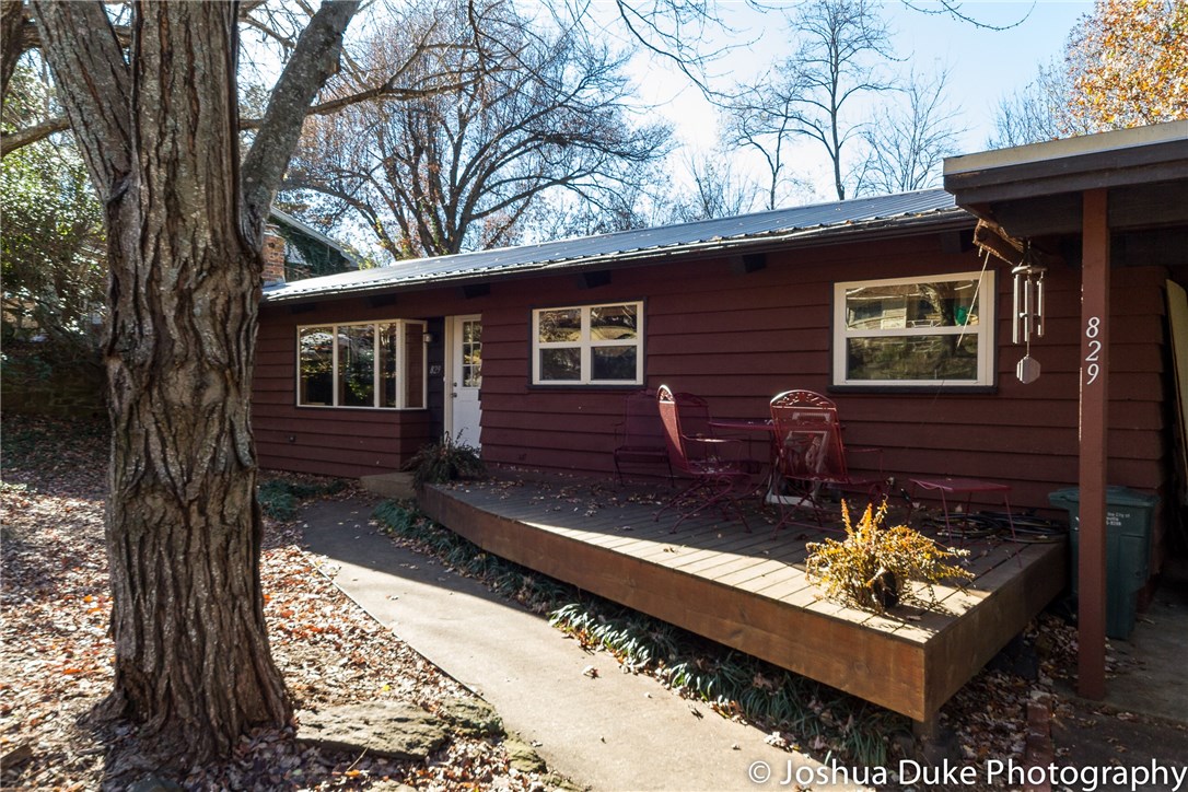 Gorgeous home with exposed ceiling timbers (insulated from above). This home is for those who love a craftsman appeal with a subtle touch of Fay Jones style. The covered patio in the backyard is perfect for late summer lounging and views of the sunset. Recently remodeled bathrooms. New HVAC in 2011. Metal roof less than 10 years old. Fireplace, hardwood floors, and indirect lighting on the main floor. Downstairs could be separate living space with wiring for kitchenette and separate entry. Must see!