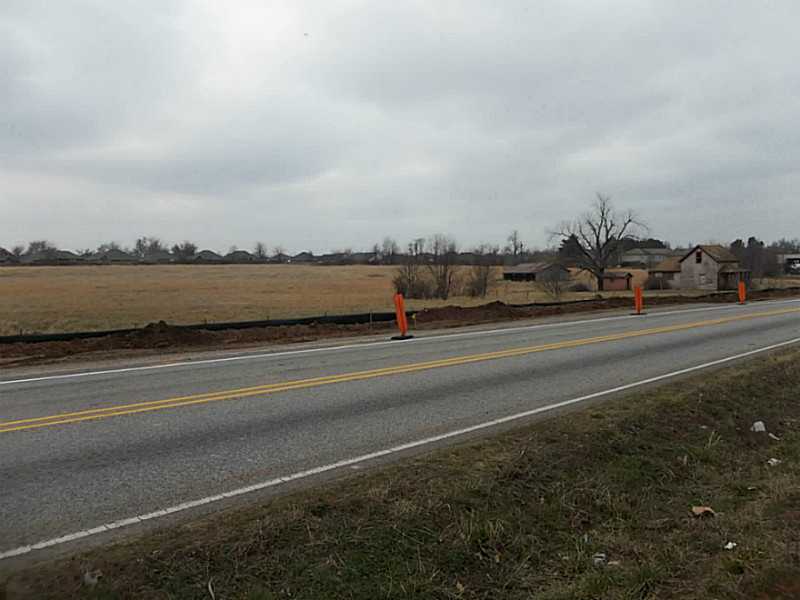 14.84 ACRES OF LEVEL CLEARED LAND. WOULD MAKE A GREAT COMMERCIAL OR RESIDENTIAL DEVELOPMENT