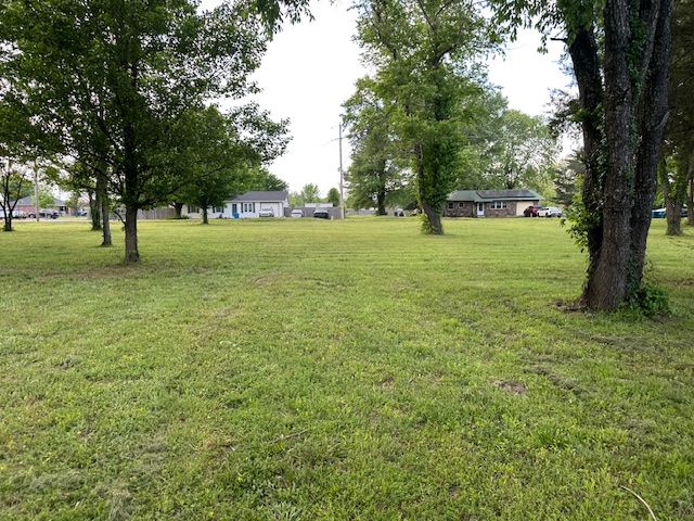 Beautiful, park-like setting!  These level, open lots with several large Oak trees add eye appeal and cool shade.  These lots are some of the last residential building opportunities in Gravette.  Come view the land and enjoy the calm, relaxation while considering the possibilities.  All of this - the 2 half acre lots (front on Meadowmere Street) Plus the 2 acre parcel includes RV parking with sewer and power hookup.  All for just the price of one home on just an average city lot.  The seller will remove the mobile home.  Also listed on mls #1334110 and mls #1344042.