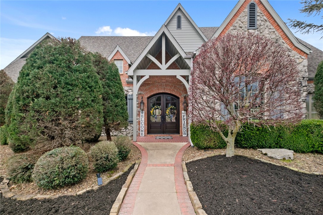 Exquisite estate for entertainers situated on 5 acres offering privacy and proximity to all Bentonville has to offer. Backyard oasis with multiple patios, heated pool, hot tub, firepit, and pool house with kitchen. Spacious interior welcomes you with large open concept kitchen and living area, formal office, & formal dining. Family room with four top custom bar perfect for movie or game nights. Additional must sees include wine cellar, workout room/storm shelter, game room, & abundant storage. Opulent primary suite boasts fireplace, private/secondary office, & showstopping closet space. Two additional bedrooms on main level PLUS two master suites on second level.  Five car garage. New roof in 2021.  This home is where quality craftsmanship and custom touches combine.