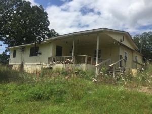 Investment Property located on 1.67 acres M/L in rural area. Property does sit on paved secondary highway.
