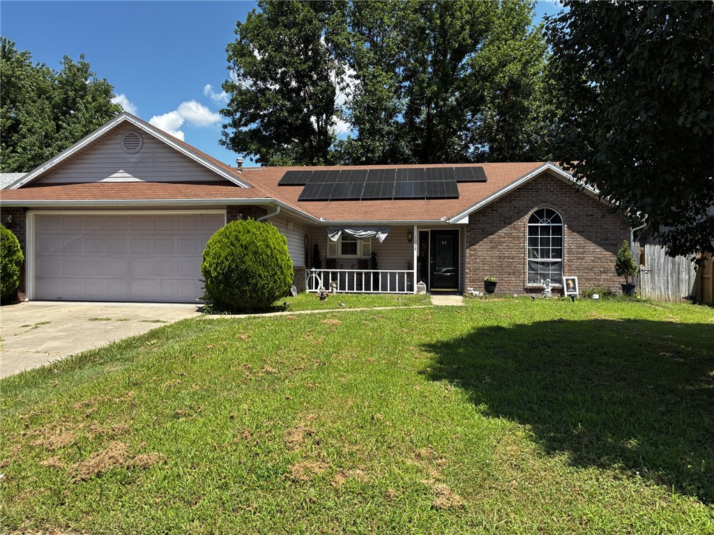 This 3 bedroom, 2 1/2 bath home offers a blend of comfort and practical living, and is designed to enhance your daily routine. The kitchen is thoughtfully designed with a counter top breakfast bar as well as an additional spacious dining area. The main bedroom  boasts two seperate closets, as well as its own full bathroom featuring a double vanity to help aid your morning routine. This property also includes a laundry room, and an attached garage for convenient parking as well as ample storage. A welcoming front porch extends the living space outdoors, along with a sunroom off the back of the house.The inclusion of solar panels reflects a commitment to efficient living.
