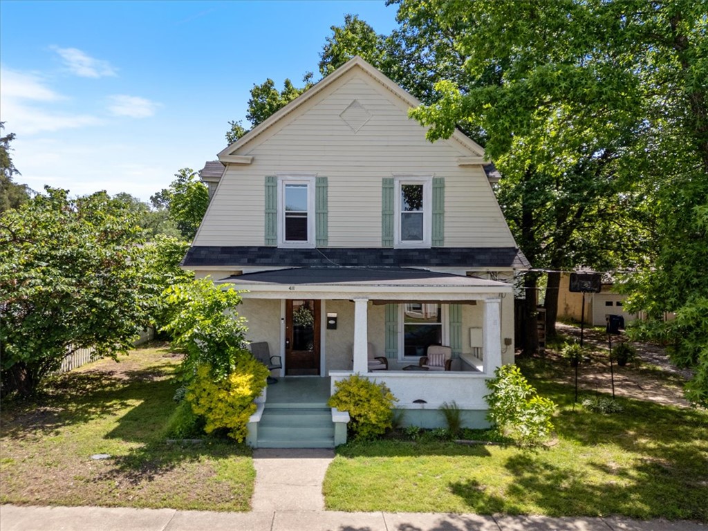 Step into timeless charm & modern comfort w/ this beautifully updated 3-bdrm, 1.5-bath home nestled in the Historic District. Rich in character & thoughtfully renovated, this property perfectly blends orig architectural charm w/ stylish contemporary updates. The fully remodeled kitchen & bathrooms feature modern finishes & conveniences while preserving the home’s warm & inviting appeal. Outside, you’ll find two versatile outbuildings adding exceptional functionality to the property —a spacious 16x10 detached building ideal for a studio, office, hobby space, or creative retreat, plus an additional 8x10 storage shed for tools, lawn equipment, or extra storage. Located just steps from downtown, you’ll enjoy easy access to local shops, dining, entertainment, & community events while still savoring the charm and tranquility of this historic neighborhood. Whether you’re relaxing at home or exploring the vibrant surroundings, this property offers the perfect balance of history, character, & modern living. HVAC new 2025