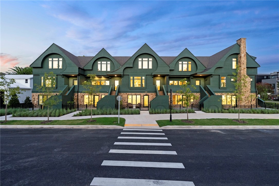 Welcome to Orchard Trailside Townhomes, Bentonville's most prestigious luxury townhome community, offering direct connection to the Downtown Trail and the Razorback Greenway. This thoughtfully designed residence features a 4bed, 3.5bath floorplan w/ a lively front patio & a private mother-in-law suite w/ its own entrance, full bath, & beverage station. Crafted w/ elevated finishes throughout, this Orchard Townhome showcases French oak engineered hardwoods, quartz countertops, custom white oak cabinetry, & cast stone fireplace. Upgrades include whole-house water filtration system, EV charging, gas range, & integrated Smart Home features such as ceiling speaker audio, Smart Lock entry, & Smart Thermostat. An oversized two-car garage completes the layout. Living at Orchard Trailside in Bentonville, AR means effortless access to the city's most desirable lifestyle amenities bike paths, parks, cafés, dining, arts venues, boutique shopping, the library, and downtown cultural experiences, all from your front door.