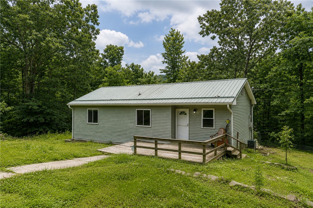 Escape to the peace and privacy of rural Elkins with this beautifully maintained 3-bedroom, 2-bath home on 3.25 scenic acres. Updated and move-in ready, this home features a new HVAC system, flooring, siding, and fresh paint—all completed within the last year. Enjoy plenty of room to roam, relax, or entertain while taking in the natural surroundings. Outdoor enthusiasts will appreciate the property's proximity to Mill Creek OHV Trail and Public Hunting, offering easy access to adventure just minutes away. Experience the perfect blend of country living and convenience in this Northwest Arkansas retreat. 30+/- minutes to Fayetteville.