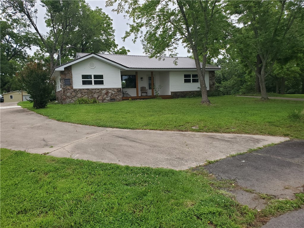 Recently remodeled 3BR/2BA home with 1,540 sq. ft. on a paved county road just 3 miles from town! The private primary suite includes its own bath and walk in closet. Enjoy central heat/air plus a wood stove for backup heat. The kitchen features propane range & custom wood countertops. Exterior highlights include a metal roof with rock/vinyl siding, scenic views, & a concrete U drive extending around the back of the home. Additional improvements include a metal 20x20 carport, 12x12 storage shed, and a 24x24 insulated, sheet rocked workshop/garage with concrete floors and its own mini-split HVAC for heating and cooling. Ideally located near the Buffalo National River as well as several major freshwater lakes & excellent trout fishing rivers. Only 75 miles from Branson, MO, offering world-class entertainment, shopping, dining, & outdoor recreation. Searcy County, AR is a great place to live and a great place to raise kids. Check out this property where you can enjoy peaceful country living with a small-town atmosphere