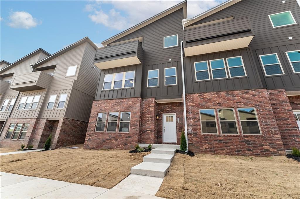 Fridge, washer and dryer included. Modern townhome in the heart of Fayetteville. You will love the location this townhouse provides while living in a new upcoming development. Large room on the bottom floor is perfect for entertainment and gatherings. 2nd floor boasts a large kitchen with granite countertops throughout with an open concept to dinning seating and an extra living area. Master suite with a balcony view and large walk-in closet along with 2 other bedrooms all on 3rd floor. Rooms are a great size with a full bath to share. Separate room for storage and/or office.