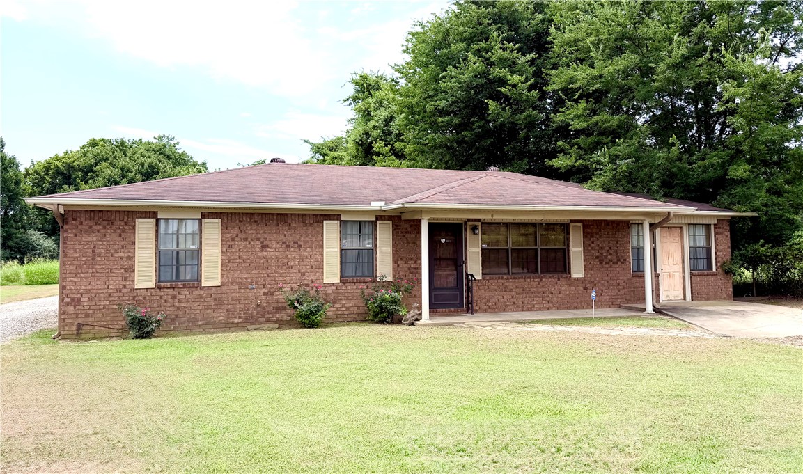This well-maintained 3-bedroom, 2-bath home offers 1,595 square feet of living space on 3 level acres. Bedrooms and the main living room feature newer carpet, and there’s a massive second living room for extra space. The eat-in kitchen includes a breakfast bar, and the seller is leaving the fridge, dryer, and freezer. A large laundry room with built-in shelving is perfect for pantry items or canning. Updates include an HVAC from 2019 and a water heater from 2020. This all-electric home also comes with 4 buildings/barns, some needing a bit of TLC.