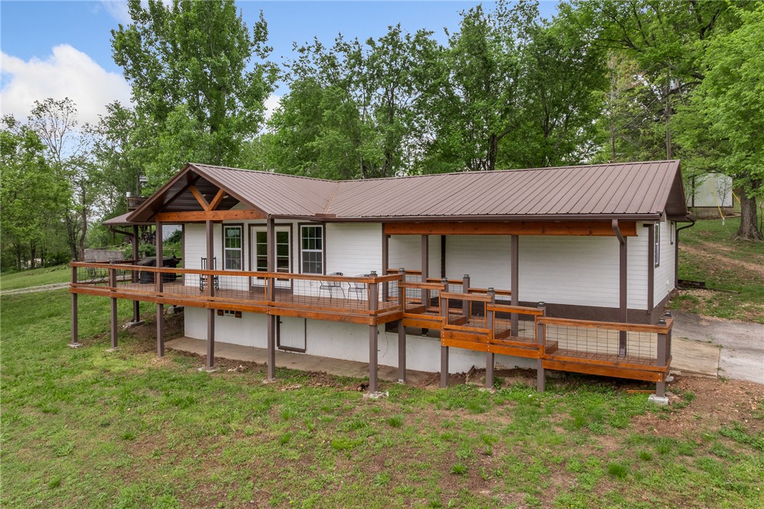 3 bed 2 bath home in a quiet setting just minutes from the lake and golf course. Features an open floor plan, updated kitchen with bar seating, and beautiful wood ceilings throughout. Enjoy the large covered deck and a big shop with plenty of space for storage or hobbies. Great mix of privacy and convenience.