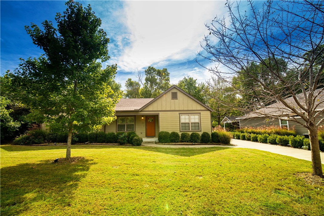 This beautiful craftsman house is a must see!  Renovations done in 2013 include low E windows, framing, drywall, cellulose insulation, wiring, plumbing, appliances, roof, HVAC, water heater, deck, carport w/ storage, extra parking pad.  Original hardwood floors refinished, subway tile in kitchen, 3 cm granite in kitchen and bathrooms.  Wood stacked rock fireplace.  Privacy fence around new hot tub pad.  Perfect location.  Easily accessible to everything, including Fayetteville trail system.