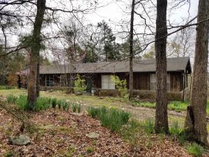 You'll want to see this 3 bedroom, 1.5 bath redwood home on 14.65 flat WOODED acres! Located on a dead end road with a ton of privacy and VALLEY VIEW. Circular drive, wood burning insert in a beautiful stone fireplace, family room AND formal living room, all with a 1200 sf heated shop! These are just a few of the features you'll love about this home.