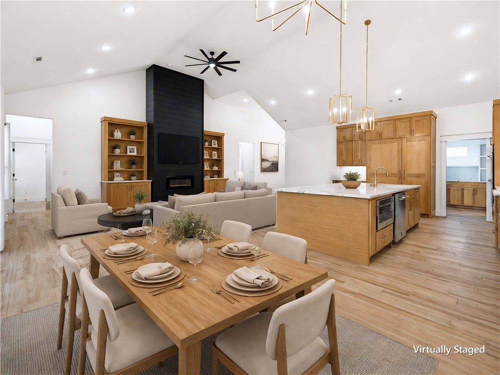 This home checks boxes you didn't know you had.  On 1.1 private, cedar-fenced acres in Timber Ridge Estates, this 2024 custom estate delivers 5,000 SF of proof: 10' ceilings, 14' entry, and vaulted living wrapped white oak built-ins.
The kitchen makes the case: 10'x5' quartz island, JennAir paneled fridge/freezer, double ovens, 6-burner gas cooktop, pot filler, and a 10'x8' sliding glass wall to the covered deck. The boxes keep coming: private theater room. Main-level office. Huge bonus room. Bottom-level in-law suite with exterior entry.
The primary bath features dual rain heads, 12 body sprayers, jetted 6'x4' tub with waterfalls and audio, plus a white oak closet with direct laundry access.
The boxes you'll feel every month: 2x6 walls, R-42 insulation, tankless recirculating water heater, fiber internet, smart-home features, and an epoxy-floored 3-car garage with 15'4" ceilings.  Custom construction. Private acreage. Zero compromises. Come check every box including the ones you didn't know you had.