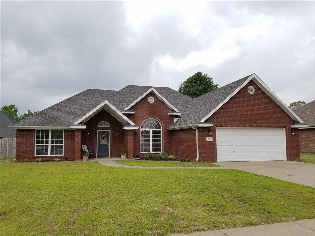Professionally remodeled home very close to Walmart Home Office & NWACC College! This home features new hardwood floors, new granite countertops & kitchen backsplash, new stainless appliances, new lighting fixtures, new hardware, new faucets, new paint, new carpet & new fireplace stone! Brand new roof, large living area, vaulted ceilings, split bedroom design, large kitchen w/breakfast & sitting room, pantry, dual fireplace, covered back patio, large formal dining, fenced back yard, and more!