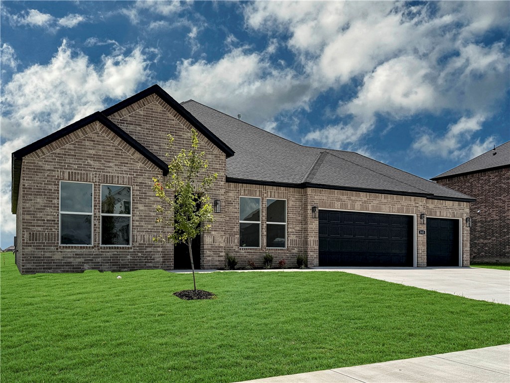 The Garland plan in Renley Rae in Springdale, AR! This plan offers 4 bedrooms and 3 bathrooms! Single-story homes feature engineered wood flooring throughout and tile flooring in the primary bathroom. The kitchen features quartz countertops, 42’’ cabinets, black hardware, and a gas range. The living room features a beautiful modern fireplace with a poplar mantle! Fans are included in all bedrooms and the living room! The primary ensuite will have a walk-in shower, separate tub, and quartz countertops! The exterior of these homes will have 4-sides brick with siding (per plan) with a 3-car garage! Each home will have a lovely covered back patio. Taxes, HOA, and parcel TBD. Home is located in Tontitown/Springdale.