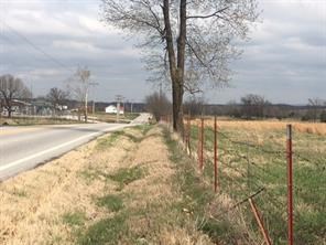 6 beautiful acres, very flat and ready to build and/or have animals, fenced at the road, all utilities available, city sewer onsite, water on north side of hwy 264.