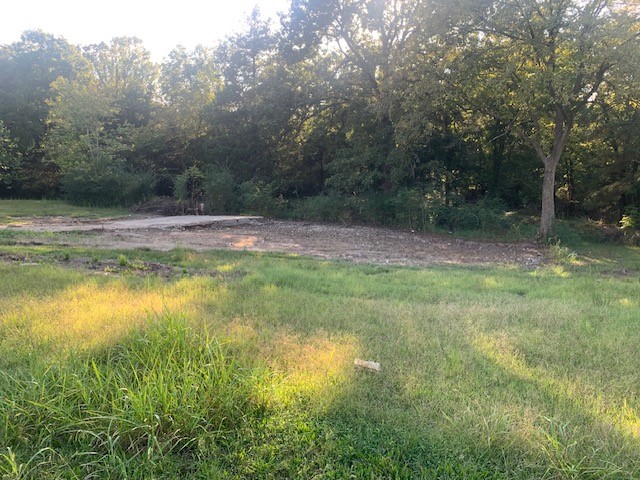 3 lots, level, paved road and all utilities. One lot is wooded and 2 have been cleared of a homeplace and ready for you to rebuild your own home. Property is located in town, just minutes to White River.