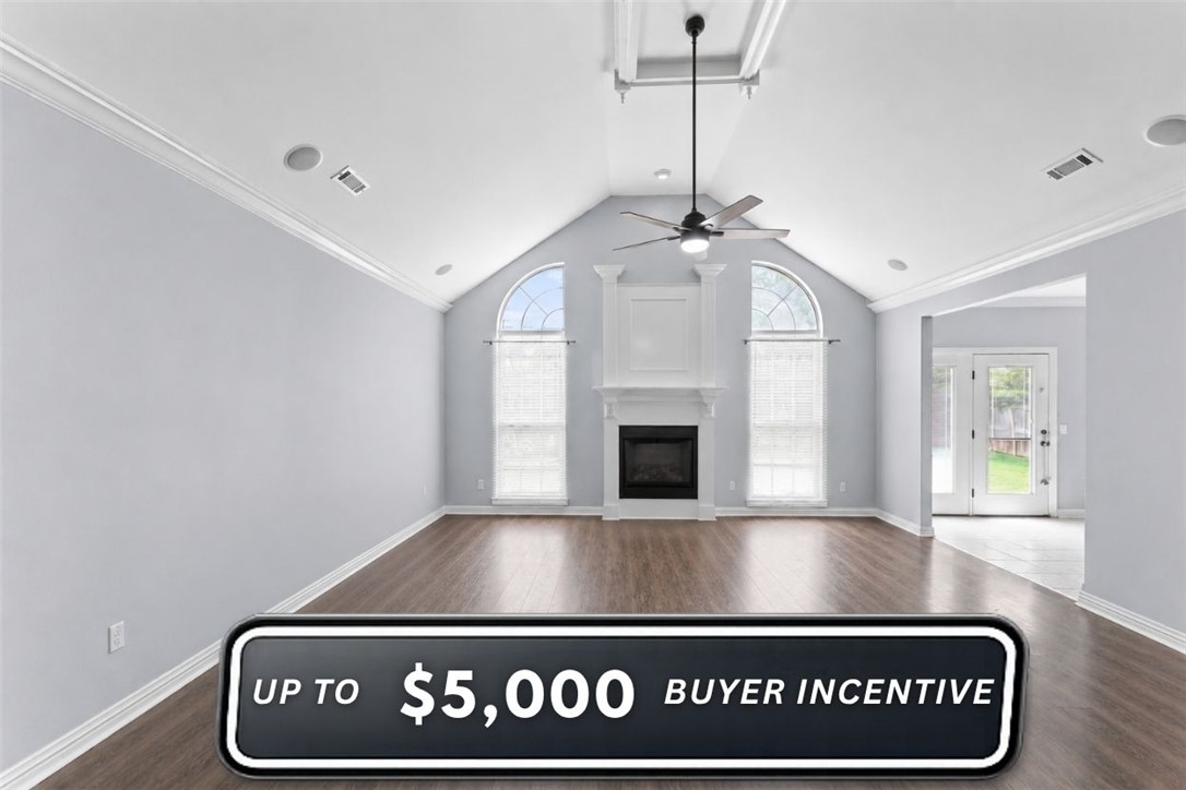 Nestled in highly desirable East Fayetteville, this stunning home offers the perfect blend of location and luxury, situated just minutes from Lake Sequoyah Park and a quick 10-minute drive to the University of Arkansas. The expansive living room serves as the heart of the home, boasting vaulted ceilings, elegant crown molding, built-in home audio, and a cozy gas fireplace, all set on durable luxury vinyl plank flooring. An entertainer’s dream, the gourmet kitchen features a massive island, abundant cabinet storage, stainless steel appliances, gas range, and a sun-drenched eat-in area framed by a wall of windows. Relax in the private primary suite, complete with double walk-in closets, a tiled walk-in shower, a jetted tub, and dual sinks. Complete with generously sized secondary bedrooms, a highly functional utility room with a sink, storage, and hanging rod, and a massive patio overlooking a flat, fully fenced backyard, this Fayetteville gem truly has it all!