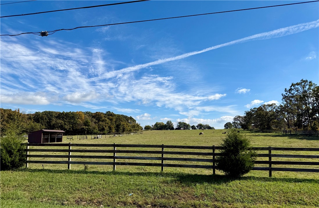 Great 14 acres m/l depending on survey. Fantastic building site. Mostly all open. Don't miss this one on a paved road not too far out of town.