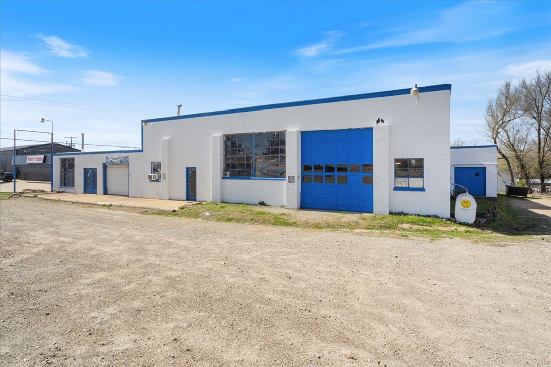 Opportunity is knocking! Dreaming of carving out a successful local business in the heart of town? This unique building will certainly position you to take advantage of the extremely high traffic count and all the added visibility that comes along with owning such a large building with tall marquee sign right on  HWY 62 between Wal-Mart and the Historic Berryville town square. While growing and building a brand this visibility will be crucial to your success. There are currently three separate units that could also be combined for one huge warehouse, mechanical/maintenance or even a specialty manufacturing application. The Gym is in the rear loading dock area & is currently being rented on a month to month basis. Up front there is a retail/office unit and let's not forget the massive mechanics garage with its high ceilings and large roll up door. The roof was replaced less than 10 years ago and the electrical in some areas/units has also recently been updated. Parking lot runs the entire length of the building.