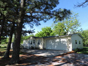 Nice 3 bedroom 2 bath home in excellent condition. Located only 3 miles from Harrison. Big Living Room, Walk-in shower in Master bedroom, walk-in closets, pantry, wide doors, handicapp accessible, double garage. Refrigerator, washer and dryer included. 8 year old roof, deck and vinly exterior. 2 storage buildings. 1/2 acre lot with big trees and very pretty, private setting.