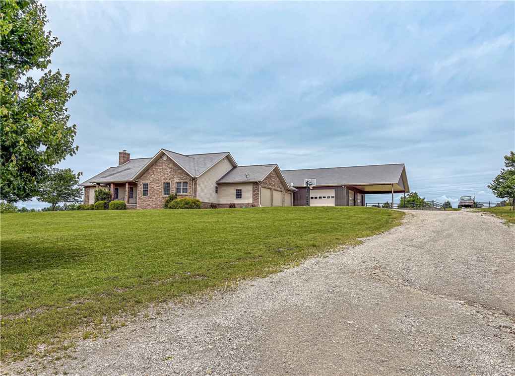 Beautiful and well maintained pullet farm on approximately 31 acres featuring 5 poultry houses, a spacious 2048 sq ft home with 3 bedrooms and 2 baths, plus a storm shelter area accessible through the crawl space. Property includes both well and rural water. The 1600 sq ft shop/garage offers ample workspace storage and has covered front parking along with a 1/2 bath.
This turnkey farm has been maintained and is ready for operation. Due to biosecurity and farm requirements, all buyers must be pre-vetted
and provide proof of funds, or a lender approval letter prior to viewing the poultry houses. Enjoy peaceful rural living with income-producing potential in a beautiful country setting. Also listed as Farm in MLS #1345624