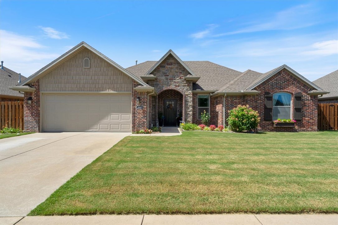 Welcome to SloanBrooke, where convenience, comfort, and curb appeal finally agree on something. Built in 2018 and impeccably maintained, this move-in-ready home sits in one of Fayetteville's most desirable locations between Owl Creek Elementary and John L. Colbert Middle School, with quick access to shopping, dining, trails, and everything NWA has to offer. Inside you'll find newer bedroom carpet, crown molding, ceramic tile, granite kitchen and bath countertops, upgraded quartz bar, stainless appliances, gas fireplace, whirlpool tub, walk-in closet, pull-down attic storage, and abundant natural light. Outside, the fully privacy-fenced backyard feels like your own botanical retreat with extensive landscaping, Eden-inspired flower gardens, covered patio with gas and electric for outdoor living, gutters, and a new storage building on a gravel foundation. Simply unpack and start enjoying life.