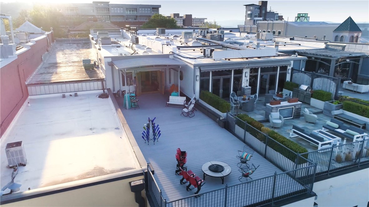 This rare gem of a condo is perfect for entertaining.  Every inch has been meticulously hand crafted and lovingly put together. A bird's eye view to the thriving square from the front and an 1100 sf balcony in the rear that overlooks Old Main.  Conveniently located in the heart of Fayetteville on the square, it is secure, extremely private and luxurious. Live the life you want in the midst of the best restaurants, farmer's market, biking trails, and retail shops.  Includes 3 covered parking spaces!