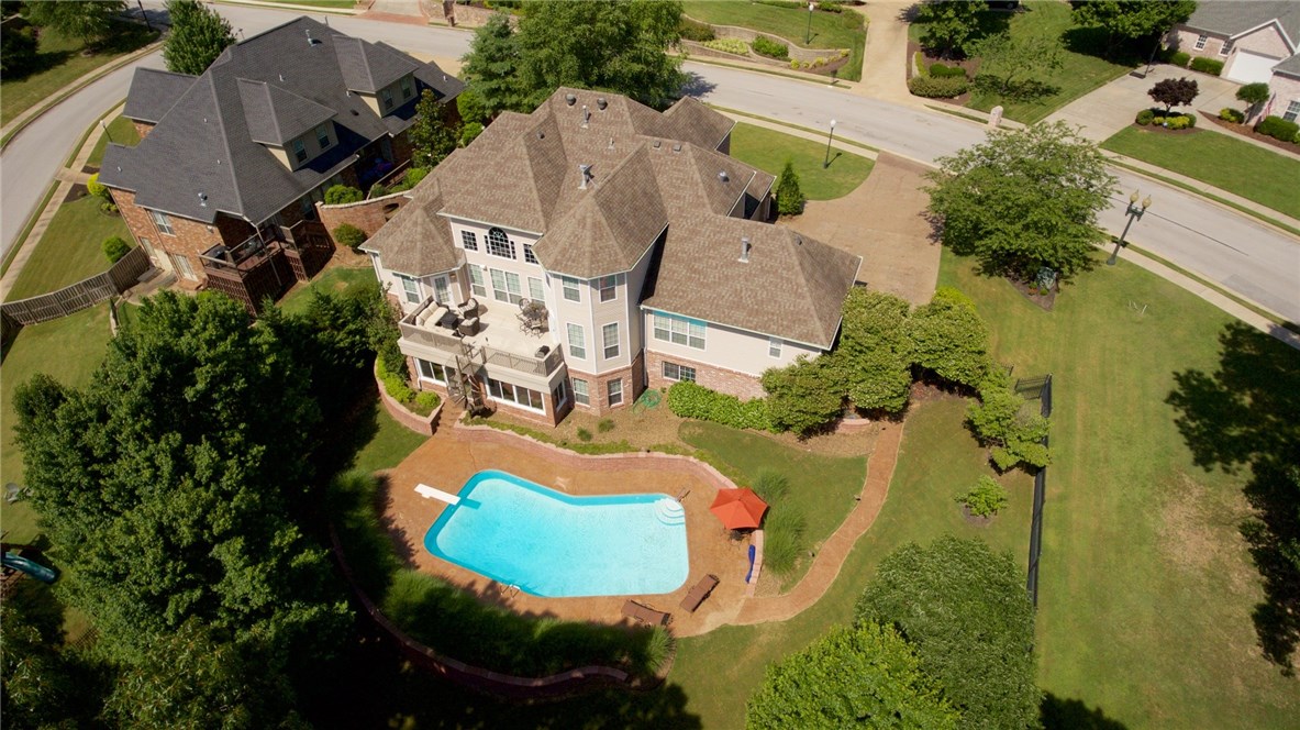 Stunning, immaculate 3 level home in a desirable neighborhood with hills, trees & close to social amenities. Entertain in this spacious eat-in kitchen open to a cozy hearth room. Huge master suite with access to the back deck/balcony overlooking the private backyard and luxurious in-ground pool. Three large bedrooms and two full baths on the upper level. The lower walk out basement with a guest suite, family/media room, game room and sunroom with a fireplace is a perfect retreat. Many extras.