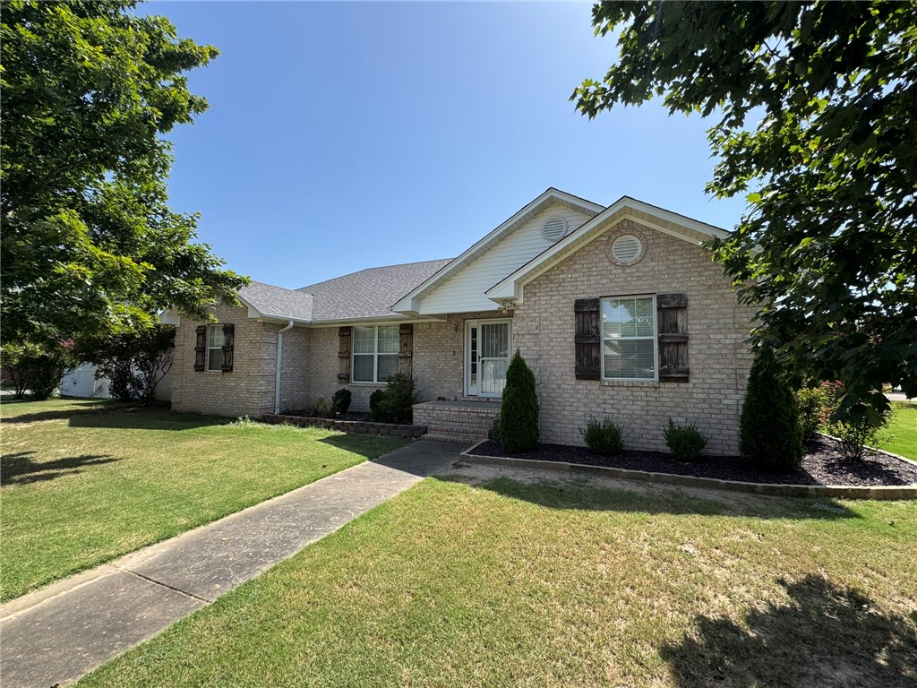 This 2,455-square-foot split floor plan home features three bedroom + office with two and half baths with updated shower in main bedroom and laminate flooring throughout home.  Conventient to schools and centrally located in town.  Outside features a concrete driveway, two patios, two open porches, and a fenced yard with storage outbuilding.