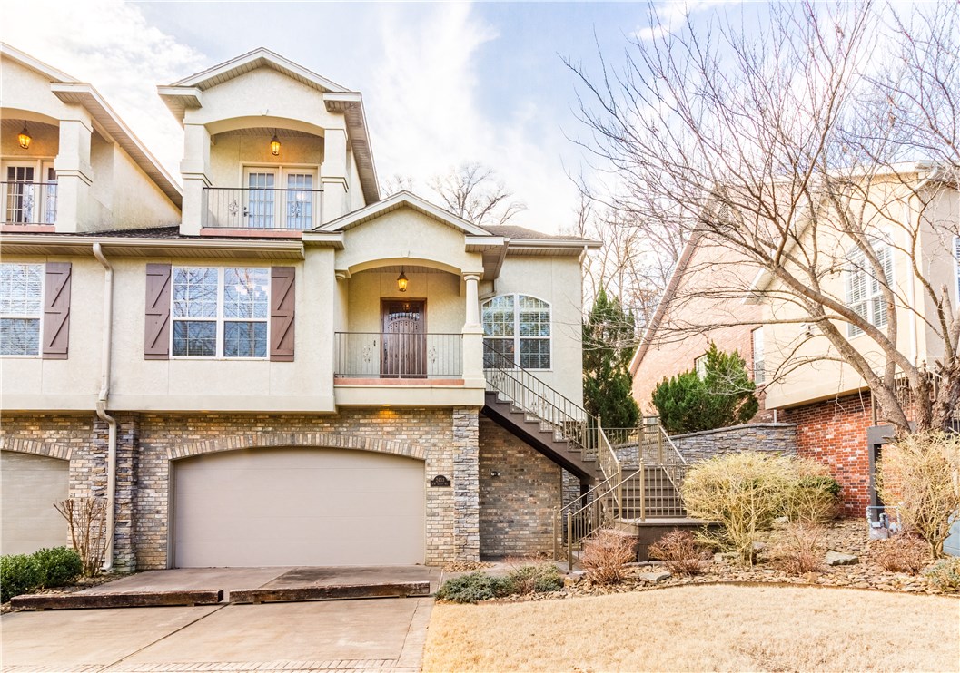 Stunning Bentonville townhome located right around the corner from the greenway trail and within minutes to downtown Bentonville and Wal-Mart HQ. 3 level townhome shows like new! This townhome was built with luxury in mind with every upgrade imaginable. Kitchen complete with custom Verser cabinets, solid granite, and top of the line Jenn-Air appliances. Second level features large living area, walk-out balcony, full bathroom, and large walk-in attic. Elevator will take you from garage to the 3rd floor.