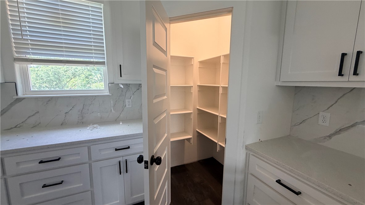**Seller is offering $5000 toward Buyer closing costs and/or concessions** Brand-new construction offering 2,327 square feet with a desirable split-bedroom floor plan, 3 bedrooms, and 2 bathrooms. The thoughtfully designed kitchen features elegant quartz countertops, a marble tile backsplash, stainless steel appliances including a gas/propane cooktop, electric oven, and dishwasher, plus ample workspace for cooking and entertaining.  The spacious living room is highlighted by a cozy gas/propane fireplace with a stylish ceramic tile surround. Throughout the home, you'll find recessed lighting, ceiling fans, and 2-inch faux wood blinds, creating a bright and comfortable living environment.  The private primary suite serves as a relaxing retreat with a spa-inspired bath featuring a soaking tub, separate tiled shower, dual vanities, and quartz countertops. Generous walk-in closets provide abundant storage space.

Taxes are currently based on land value only.